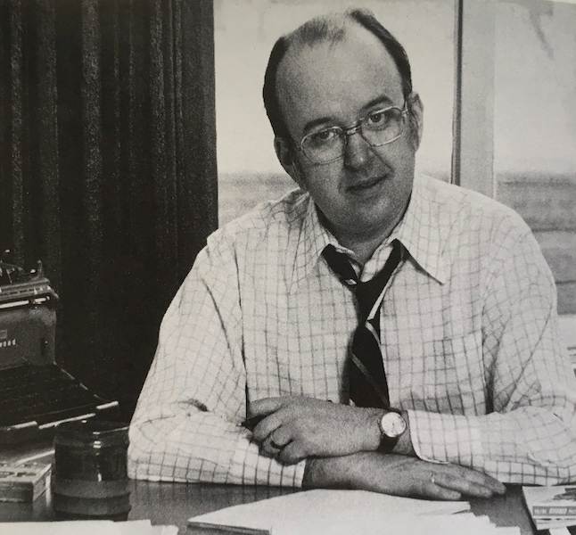 Robert Fulford at desk with typewriter