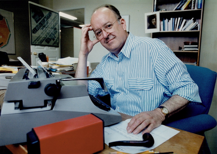 Robert Fulford at desk with typewriter