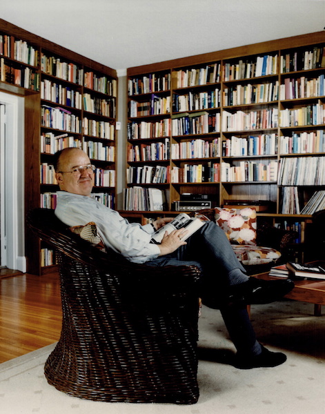 Robert Fulford in living room, with bookshelves